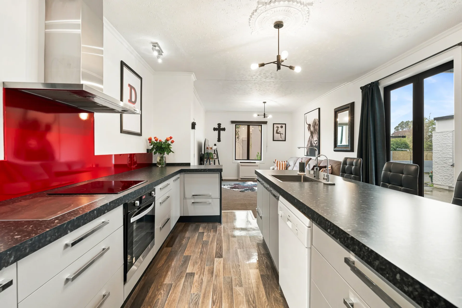 1/223 Queens Drive kitchen with red splashback